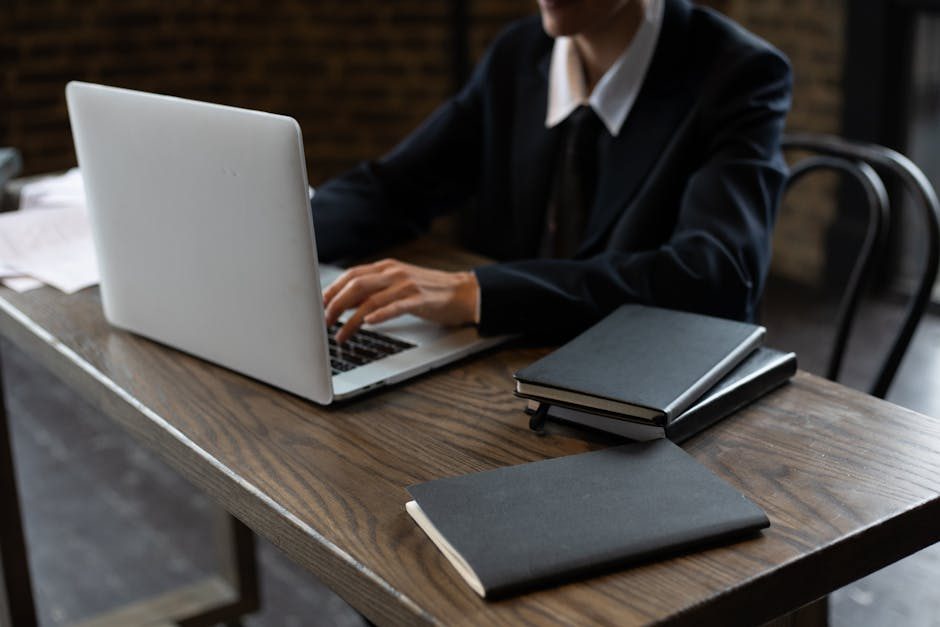 How to work hard — Person Working Hard At Desk With Laptop And Notebook - image 2