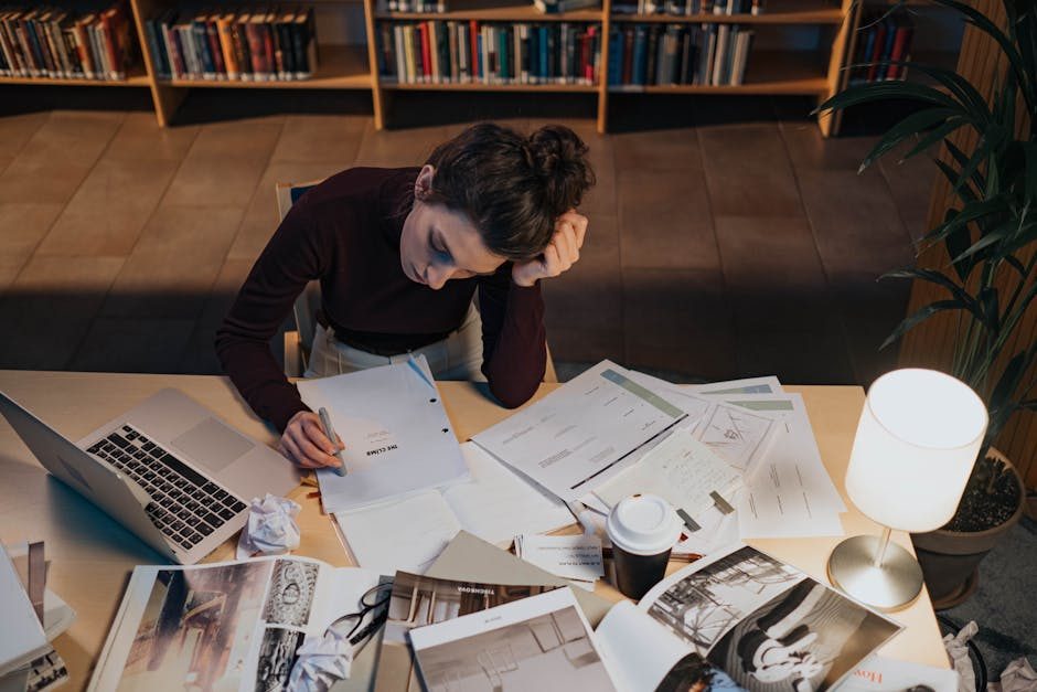 How to work hard — Person Working Hard At Desk With Laptop And Papers - image 2