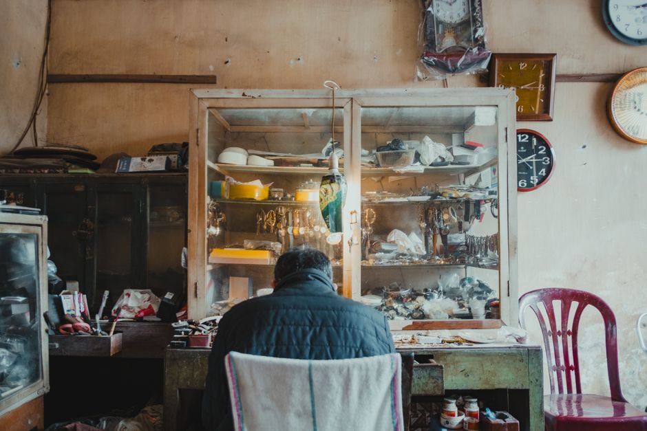How to work hard — Person Working Hard At Desk With Clock In Background - image 2