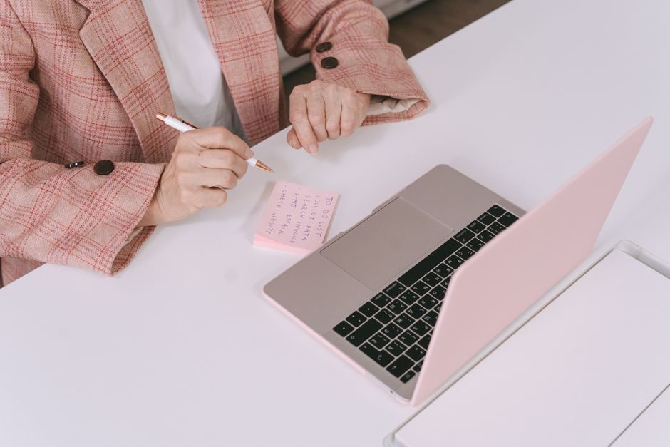 How to work hard — Person Working Hard At Desk With Laptop And Notes - image 2